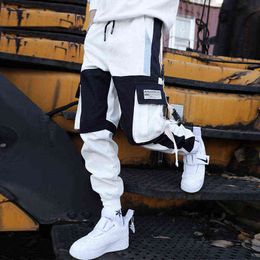 Nuovi pantaloni cargo da uomo Hip-Hop cuciture larghe pantaloni streetwear maschili Harajuku pantaloni multi-tasca a contrasto pantaloni a figura intera G0104