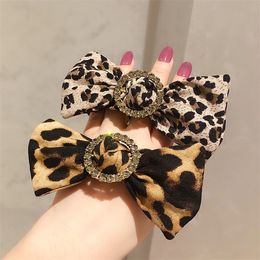 Autumn and winter new round buckle drill bow leopard circle Czech diamond boutique quality leather band hair rope