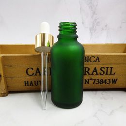 Light-proof 5ml 10ml 15ml 20ml 30ML 50ML 100ML Frosted Green Beard Oil Body Oil Glass Bottle with Gold Dropper Lid Custom Logo Empty Essential oil Serum Dropper Bottle