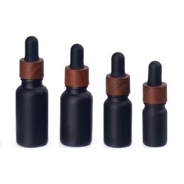 Black frosted glass dropper bottles essential oil perfumes bottle with wood grain plastic cap 5ml to 100ml