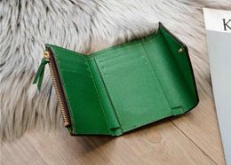 Top New Zipper VICTORINE Emilie Button Women Short Wallets Fashion Shows Exotic Leather Pouch Round Coin Purse Card Holder M624722383