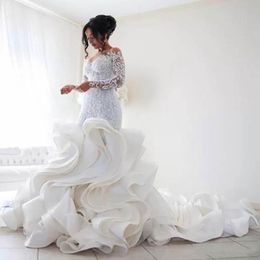 Novo vestido de noiva de babados em cascata com mangas compridas corpete de ilusão capela de trens sereia butiques de casamento de ponta
