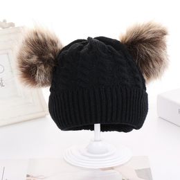 New autumn and winter European and American children's double wool ball twist knit hat hat knitted baby pullover cap in stock