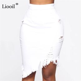 Liooil Asymmetric Cotton Black White Hole Denim Midi Skirt With Tassel Streetwear High Waist Wash Distressed Women Bodycon Skirt 210310