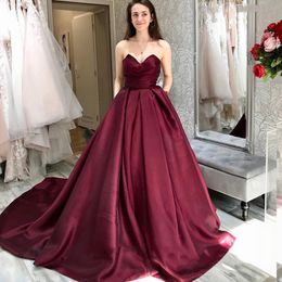 Burgundy Strapless Ball Gown Satin Prom Dresses Sweep Train Lace-up Back Foraml Evening Gowns with Pockets