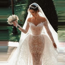 Luxuriöse Dubai-Meerjungfrau-Brautkleider mit transparentem Ausschnitt und Überrock, maßgeschneidertes Brautkleid mit langen Ärmeln und eleganten Roben de Mari￩e