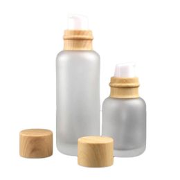 New arrival New product frosted glass 150ml 50ml serum/lotion/emulsion bottle 50g jar with imitate wood grain lids
