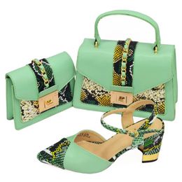 green shoes and matching bolsa