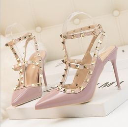 New 10CM PUMPS woman Sexy nightclub stiletto heels patent-leather metallic rivet hollow Roman fashion sandals