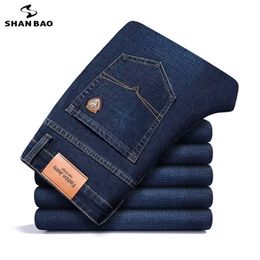 SHAN BAO autumn spring fitted straight stretch denim jeans classic style badge youth men's business casual jeans trousers 211120
