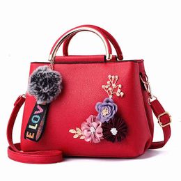 HBP Non- Solid color fashion three dimensional embroidery flower iron handle portable Pu women's bag Korean trend classic 3 sport.