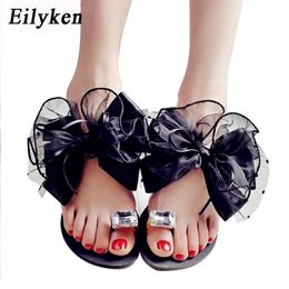 Eilyken Summer Bowtie Flower Flat Sandals Slippers Casual Fashion Female Beach Flip flops Women Mesh Grey Black Slippers 210310