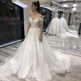 Off the Shoulder A Line Lace Wedding Dresses Short Sleeves Sweep Train Lace-up Back Sequins Appliqued Plus Size Bridal Gowns