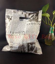 50pcs/lot Black Newspaper Design Plastic Gift Bag 25x35cm Clothes Jewellery Packaging Bag Big Plastic Shopping Bags With Handle