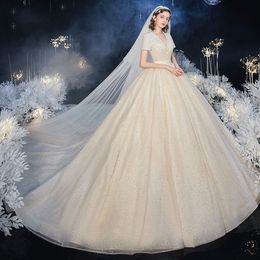 Abito da ballo di lusso Abiti da sposa Maniche corte Scollo a V profondo Paillettes Appliques Pizzo Abiti da sposa da sposa arabi Abiti da sposa in cristallo