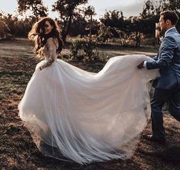 Romantic Ivory Long Train Country Wedding Dresses A Line Lace Full Sleeve Sexy Open Back Illusion Bohemian Beach Wedding Dress Bridal Gowns