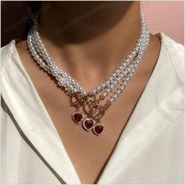 Elegante collana con pendente in pietra preziosa di cristallo rosso a forma di cuore Collana con catena di perle per accessori per gioielli da donna alla moda