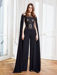 Stylish Arabic Dubai Black Jumpsuit Evening Dresses For Women 2022 Cape Sleeve Lace Appliques Hollow Out Long Pant Suit Party Prom Gowns Formal Occasion Dress
