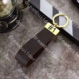 Porte-clés de créateurs de mode de luxe de luxe à la main PU en cuir PU-Cuir Keychain Femme Sac Charm Pendentif Accessoires