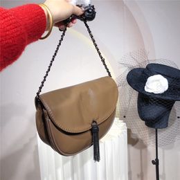 Advanced texture Luxury Design shoulder bag Decorative tassels with black hardware letters women's fashion Bags Half moon soft Cowhide Purse