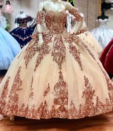 2024 Abiti da ballo Quinceanera sexy in oro rosa con paillettes Sweetheart Paillettes Applicazioni in pizzo Tulle di cristallo Sweet 16 Corsetto Indietro Abiti da sera da ballo