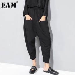[EAM] New Spring Autumn High Elastic Waist Loose Black Pocket Split Joint Loose Harem Pants Women Trousers Fashion JX5070 210319