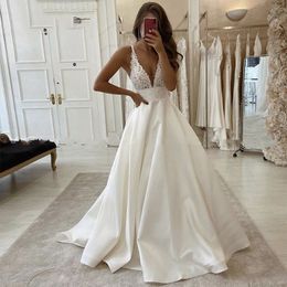 Hochzeits Sommerstrand 2021 Sexy Speghetti-Träger tiefe V-Ausschnitt-Braut Kleider Sweep Zug Vestidos de noiva heiß