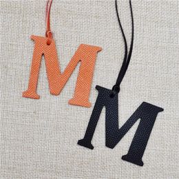 Initial M letter keychains for women charm bag holder ornaments real leather keyring car pendant solid color personality chains
