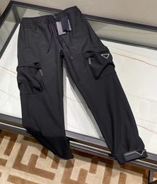 Pantaloni neri di lusso di nuova moda per l'autunno e l'inverno ~ pantaloni cargo da uomo firmati multi-tasche in cotone di alta qualità con slip in seta di alta qualità