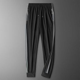 Pantaloni Uomo 2021 Nuova Estate Seta Ghiaccio Traspirante Pantaloni Casual Uomo Pantaloni Climatizzati Cuciture Pantaloni Ad Asciugatura Rapida Streetwear Y0811