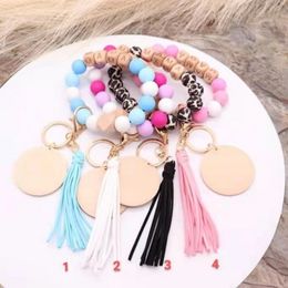 Wholesale foreign trade food grade silicone beads wrist keychain blank disc key ring pendant female multi-color optional