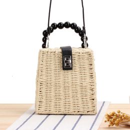 HBP Non-Brand Lovely wooden bead hand summer beach forest series metal lock one shoulder straw woven bag sport.0018
