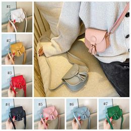 Mini children's bags Purse version of pure color soft surface simple and cute one-shoulder diagonal bag tassel decorative wallet JJA938