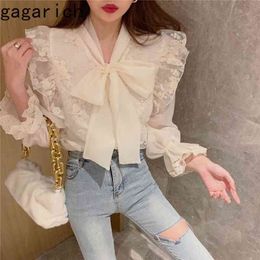Gagarich Women Shirt Spring Autumn French Retro Palace Style Temperament Ladies Sweet Bowknot Tie Flared Sleeve Lace Blouse 210323