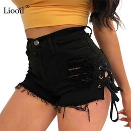 Liooil Tassel Denim Shorts Women Summer Mid Waist Cotton Sexy Rave Jean Short Lace Up Hollow Out Black White Jeans 210719