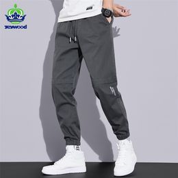 İlkbahar Sonbahar Kargo Pantolon erkek Trendy Açık Ayak Bileği Bantlı Pantolon Gevşek Elastik Bel Tulum Harem Pantolon Büyük Boy M-4XL 211013