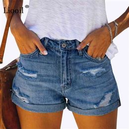 Liooil Sexy Skinny Curly Denim Shorts With Hole Tassel Women Summer Streetwear Pockets Mid Waist Blue Ripped Jean Shorts 210323