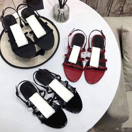 Leather Sandals Summer new product Ladies shoes Roman flat-bottomed beach sandals Metal Button Sexy Banquet Woman shoes Large size 35-40-41 999