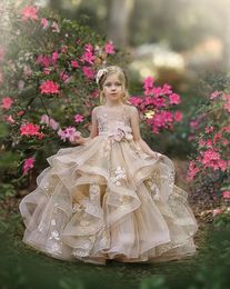 2021 Cute Champagne Flower Girl Dresses For Weddings Jewel Neck Puffy Ruffles Tiered Floral Little Kids Baby Gowns First Communion Dress With Bow Open Back