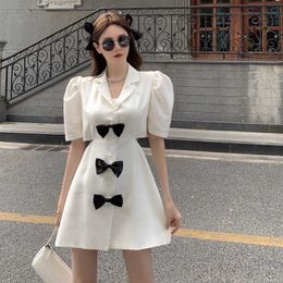 White Notched Puff Sleeve Bow Backless Dress Women Mini Summer Chic Vintage Black Single Breasted Hollow Out Sexy OL Fashion 210610