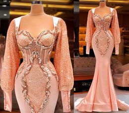 Plus Size Arabo Aso Ebi Lussuosa sirena Abiti da ballo sexy rosa pesca Pizzo con perline Maniche lunghe Abiti da sera per feste convenzionali Abiti da ricevimento CG001