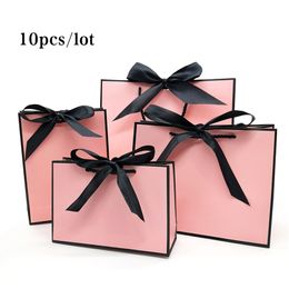 pink paper gift bags wholesale UK - Pretty Pink Kraft Gift Bag Gold Present Box For Pajamas Clothes Books Packaging Gold Handle Paper Box Bags Kraft Paper Gift Bag 220110