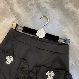 Skirts FABPOP Summer Design High Waist Black Ruffles Pin Decoration Short Mini Skirt Pockets Women GB659 210709