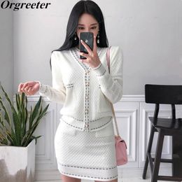 New Knitted Sweater Dress Set Fashion Temperament V-neck Pearl Button Knit Cardigan Jacket Short-sleeved Dress 2 Piece Set 210330