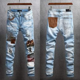 er Ripped motorcycle Jeans Clothing zipper Pants Light Blue Luxury Men Slim Denim Straight Biker Hole Hip Hop fashion rock revival jean KYSS