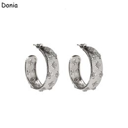 Donia Jewellery luxury stud European and American fashion four-leaf flower C-shaped titanium steel three-color creative designer earrings gift