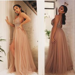 2023 Sexy Champagne Prom Dresses Spaghetti Straps Sleeveless Illusion Crystal Beading High Side Split Floor Length Tulle Open Back Party Dress Evening Gowns