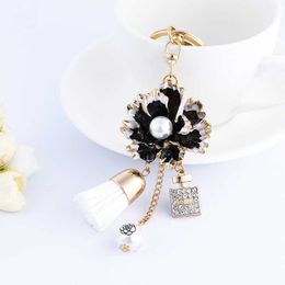 XDPQQ creative new Korean version of dripping oil pearl flower alloy keychain car pendant camellia bag tassel pendant G1019