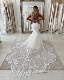 2022 abito da sposa a sirena in pizzo moderno coda lunga coda sexy sexy smero senza schienale boho spiaggia abiti da sposa appliques gioiello manichetta senza maniche abiti da sposa avorio bianco avorio