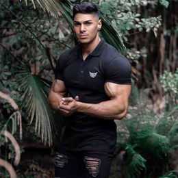 Muscleguys Brand Men Compression Polo Shirt Cotton Tops Fashion Sport Short Sleeve Gym Bodybuilding Fitness Polo Shirt Plus Size 210421